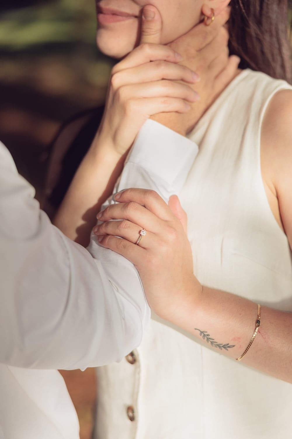 Close-up of an engagement ring on a woman's hand during a Canberra engagement shoot.